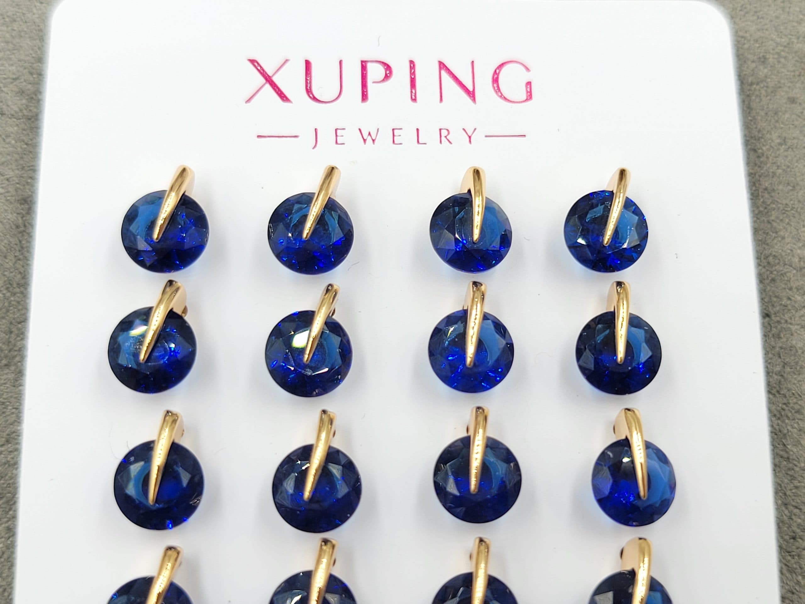 Гвоздики Xuping 7 мм з синім стразом колір 18к