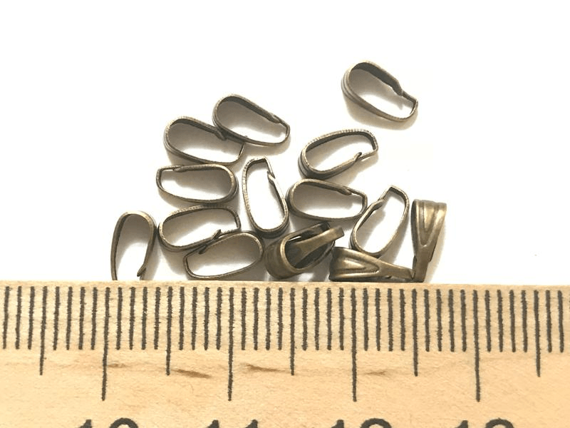 Держатели для бусин 7*4 около 230 шт цвет бронза