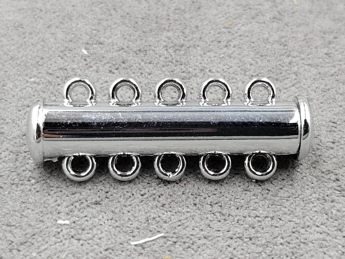 Замок магнітний 6*28 мм на 5  ліній колір сталь