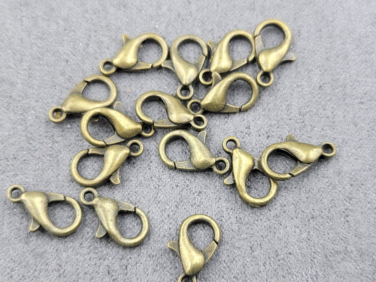 Замки 10 мм (металл) 100 шт колір бронза
