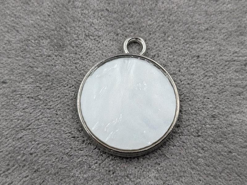 Підвіска коло 17*20 мм в металі стального кольору