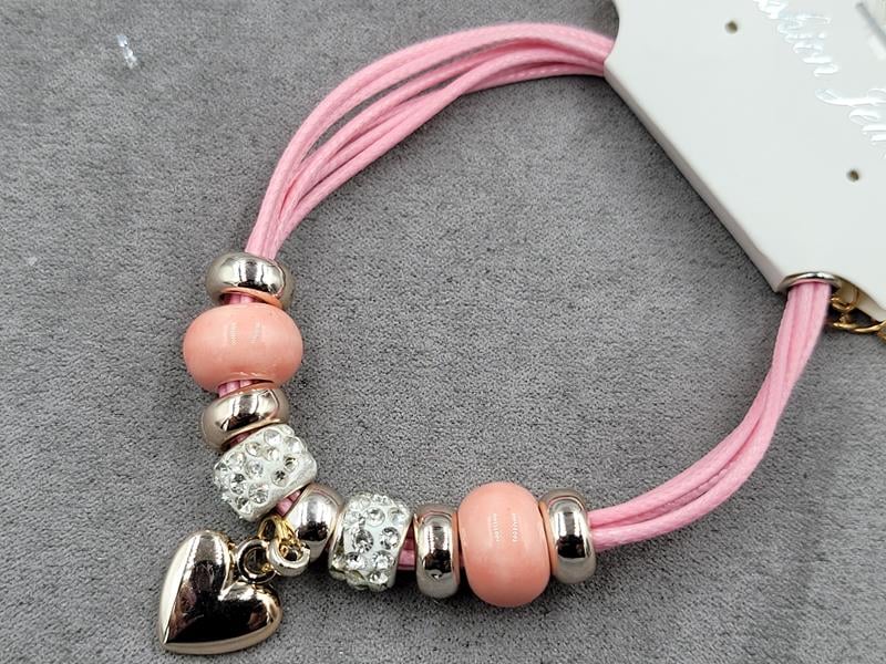 Браслет рожевий с підвіскою серце колір золото