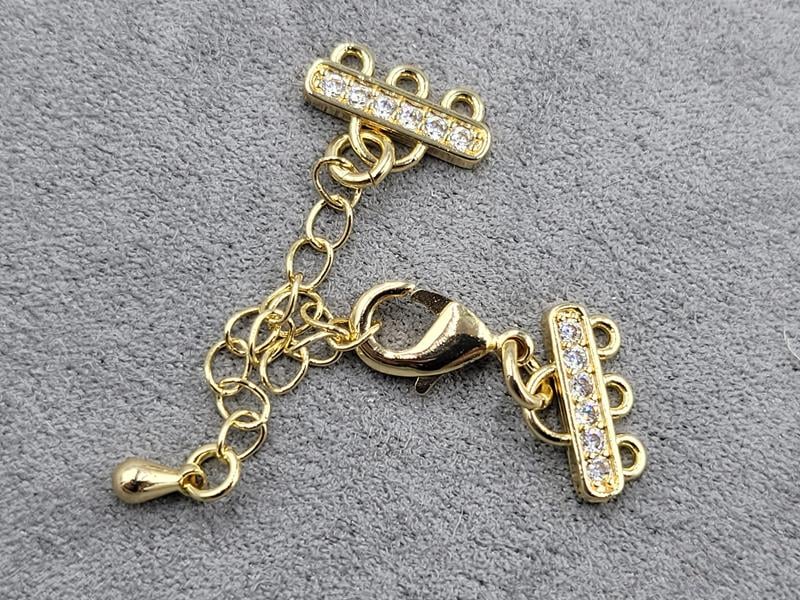 Замок на 3 лініі з фіанітами колір  золото (гіпоалергений сплав)