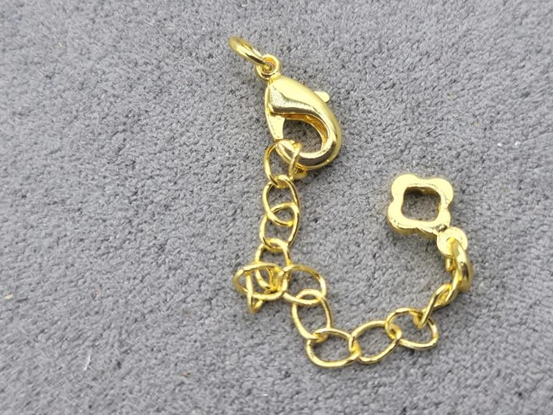 Замок 10 мм колір лимоне золото з підвіскою конюшина (гіпоалергенний сплав)