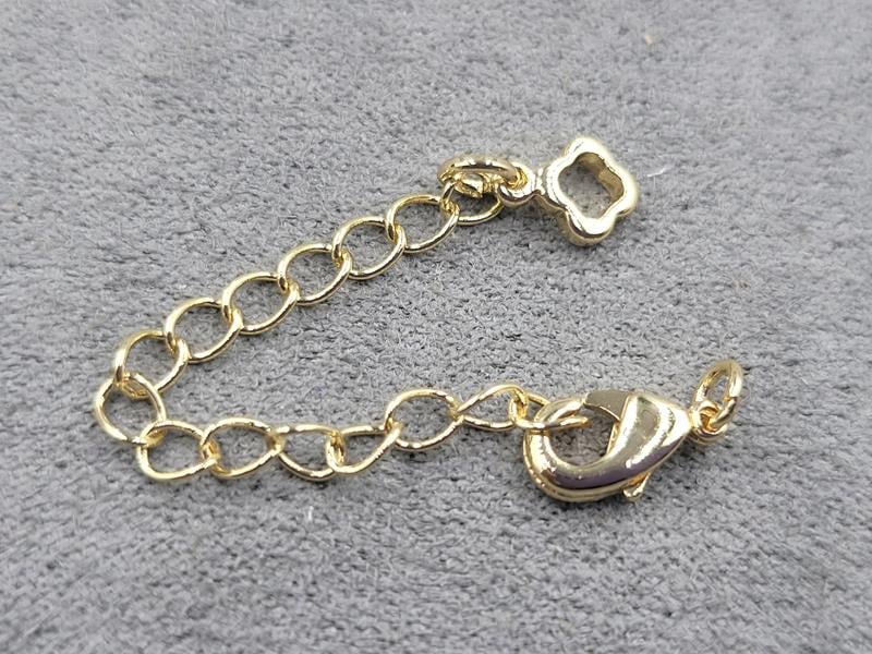 Замок 10 мм колір золото з підвіскою конюшина (гіпоалергенний сплав)