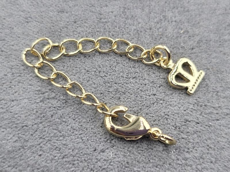 Замок 10 мм колір золото з підвіскою корона (гіпоалергенний сплав)