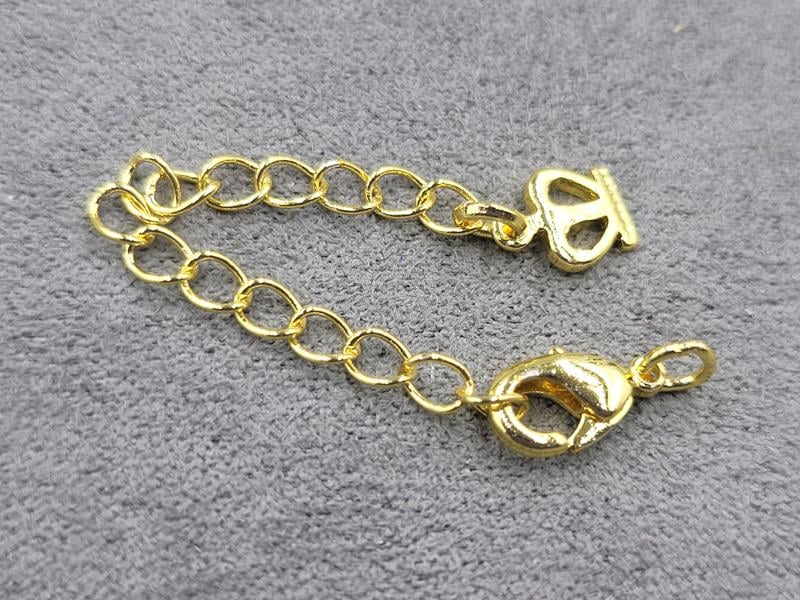 Замок 10 мм колір лимоне золото з підвіскою корона (гіпоалергенний сплав)