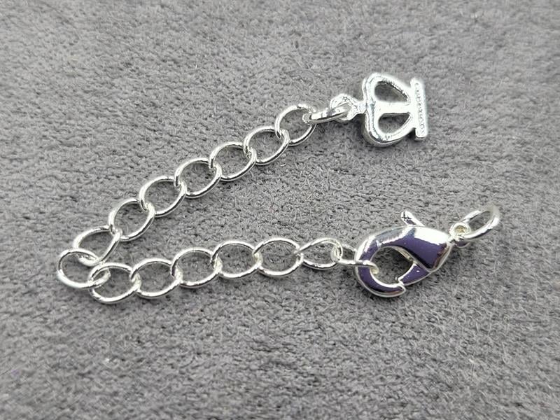 Замок 10 мм колір срібло з підвіскою корона (гіпоалергенний сплав)