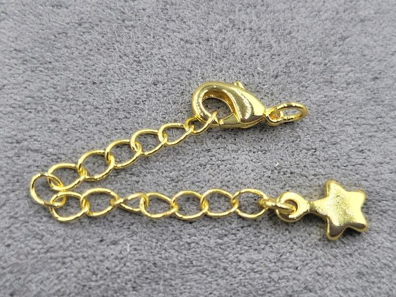 Замок 10 мм колір лимоне золото з підвіскою зірка (гіпоалергенний сплав)