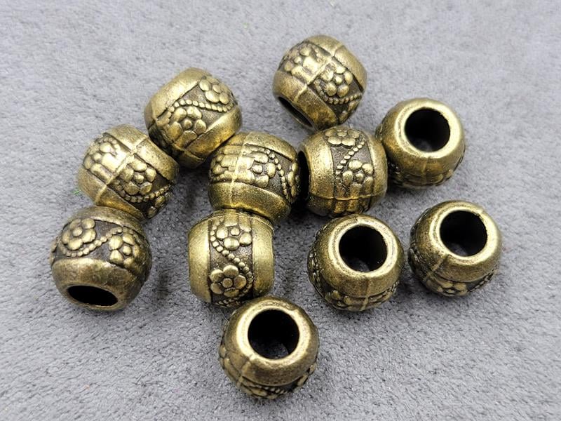 Бусини 8*9,6 мм отв. 4,4 мм 11 шт колір бронза (метал)