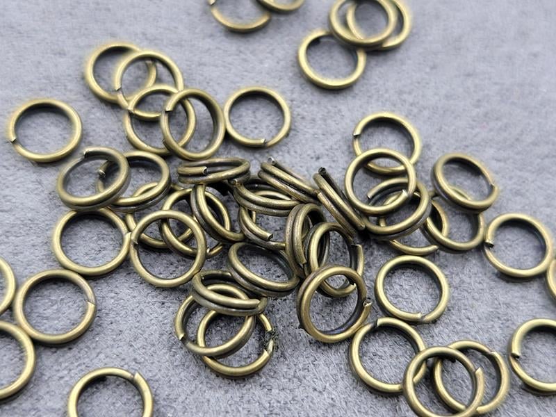 Двойні з'єднувальні кільця 6 мм біля 200 шт колір бронза