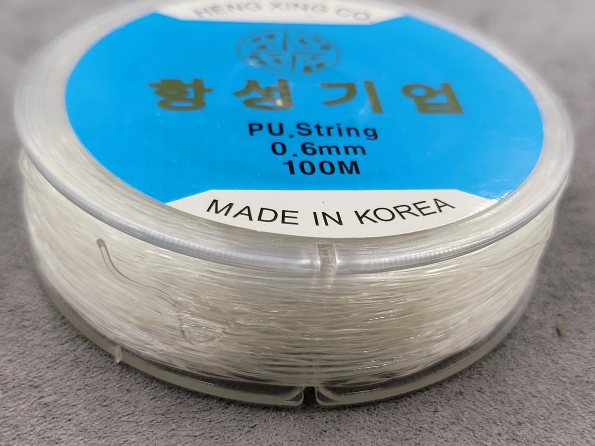 Резинка для браслетів 0,6 мм 100 м  підсилена