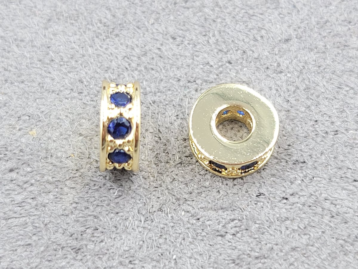 Рондель 3*7 мм отв. 2,7 мм з синіми фіанітами колір лимонне золото (гіпоалергений сплав)