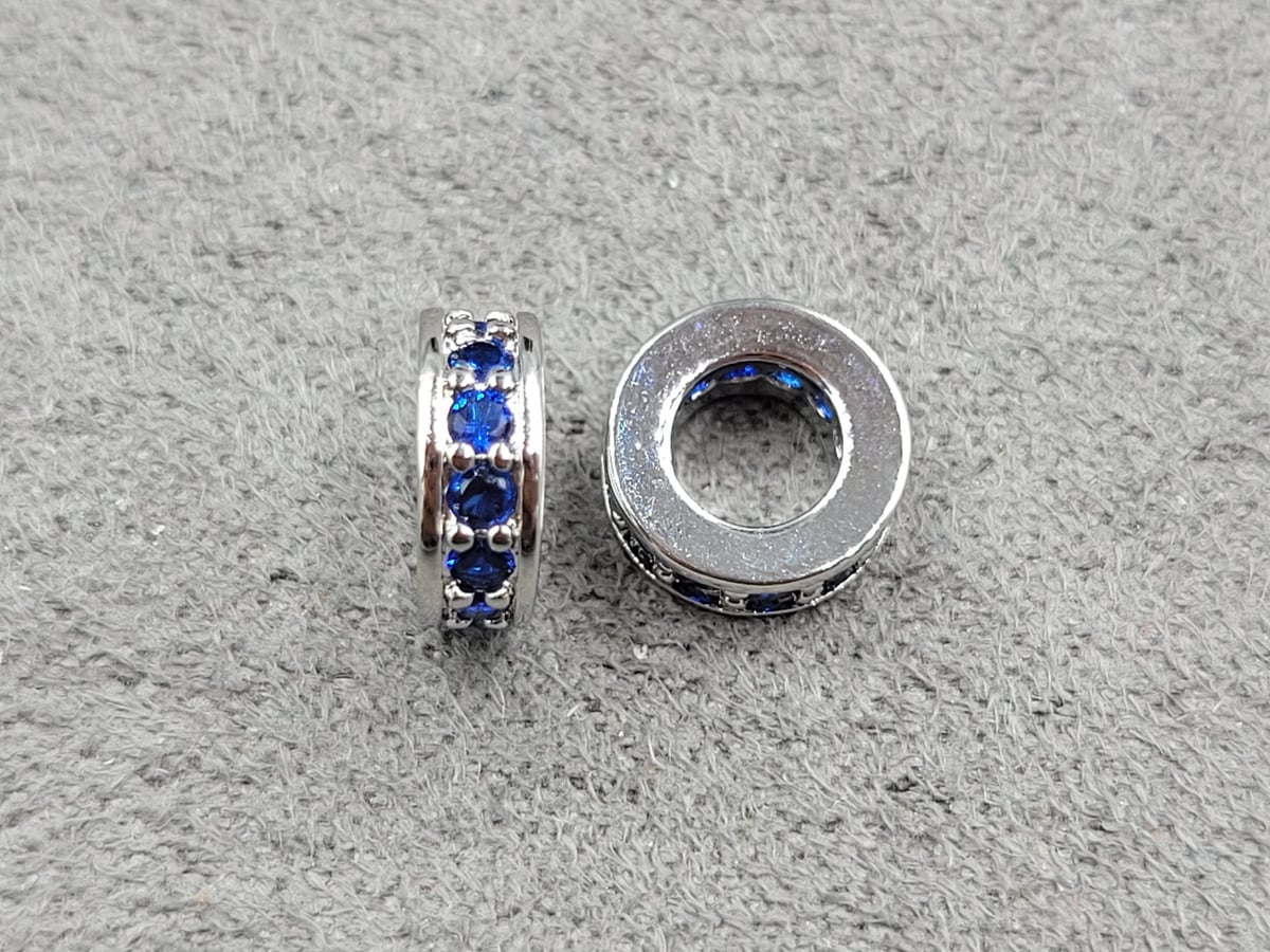 Рондель 3*7,5 мм отв. 4 мм з синіми стразами родій (гіпоалергений сплав)