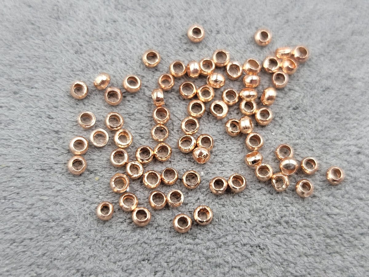 Стопери 2 мм 100 шт колір рожеве золото (гіпоалергений сплав)