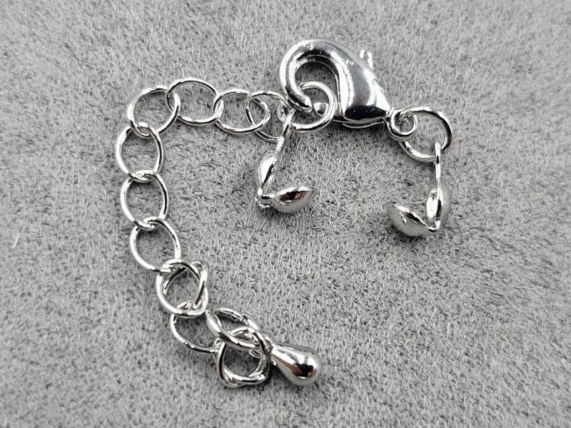 Замок 12 мм колір сталь з колотами (гіпоалергенний сплав)