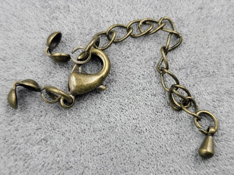 Замок 12 мм колір бронза з колотами (гіпоалергенний сплав)