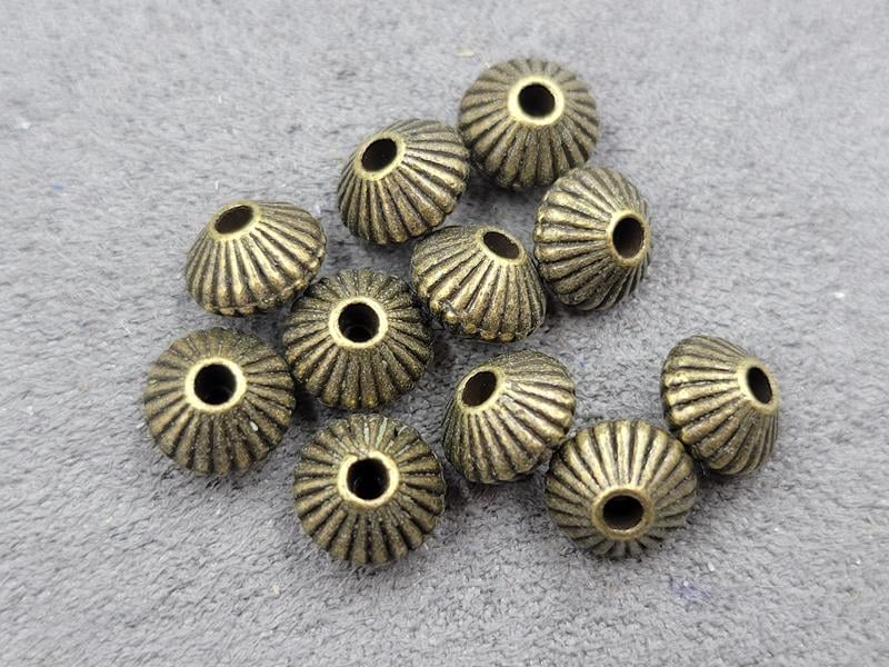 Бусина 5*7 мм 30 шт колір бронза