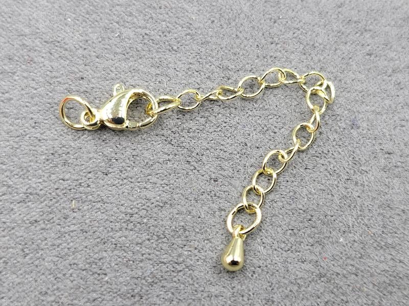 Замок 10 мм колір лимонне золото з підвіскою крапля (гіпоалергенний сплав)