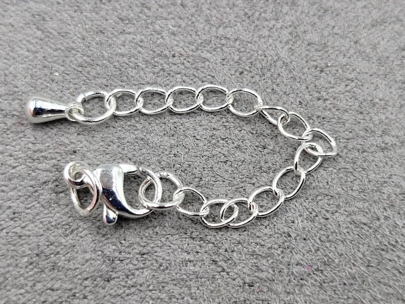 Замок 10 мм колір срібло з підвіскою крапля (гіпоалергенний сплав)