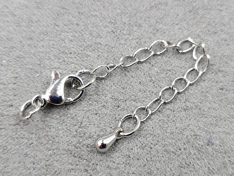 Замок 10 мм колір сталь з підвіскою крапля (гіпоалергенний сплав)