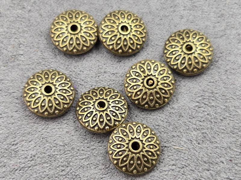 Бусини 11*4 мм 12 шт колір бронза