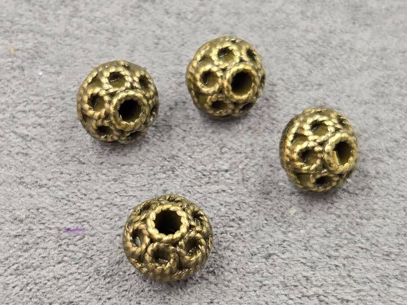 Бусини 7*8 мм 17 шт колір бронза