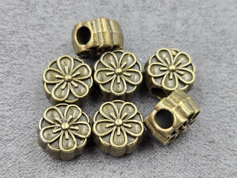 Бусини 11*7 мм 10 шт колір бронза