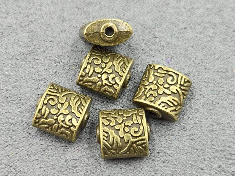 Бусини 10*11*5 мм 11 шт колір бронза