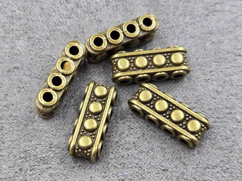Бусини 7*5*17 мм 12 шт колір бронза