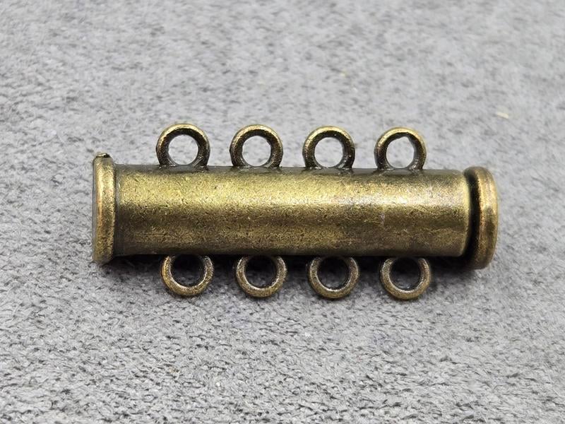 Замок магнітний 6*27 мм на 4 лінії колір бронза
