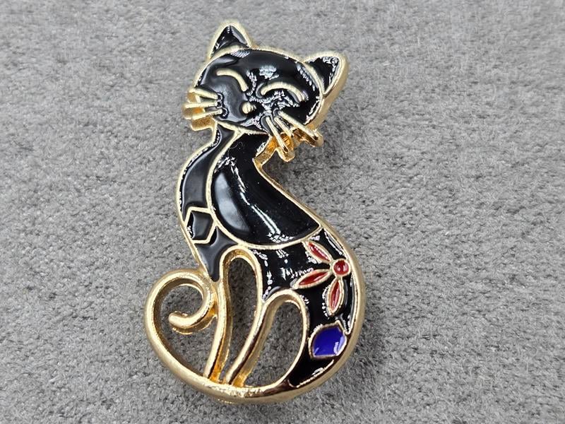 Брошка 17*29  мм чорна в золоті